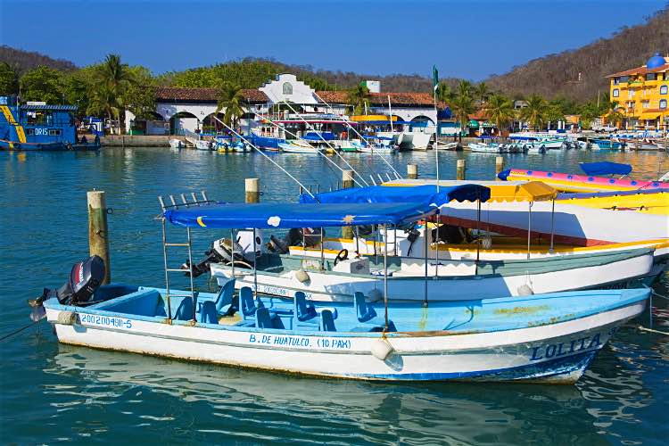 Huatulco has managed to retain its fishing village charm despite recent development. Image by Richard Cummins / Robert Harding World Imagery / Getty Images