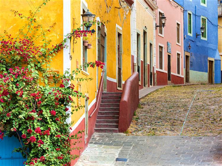 Multi-colored houses are traditional to Guanajuato. Image by Danita Delimont / Gallo Images / Getty Images