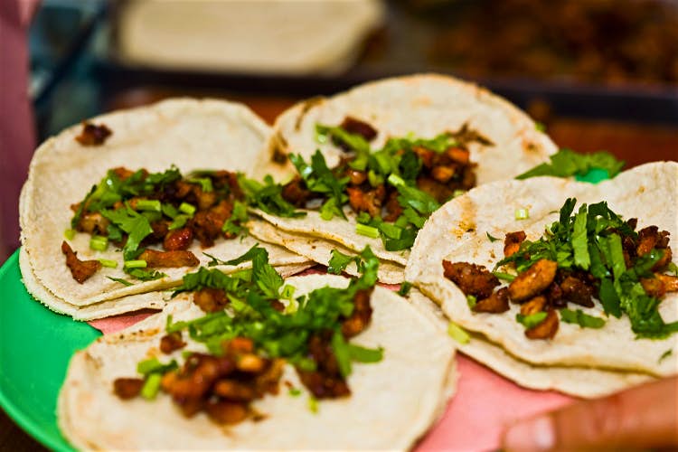 Pork tacos are a local specialty in Puebla. Image by Glow Images / Getty Images